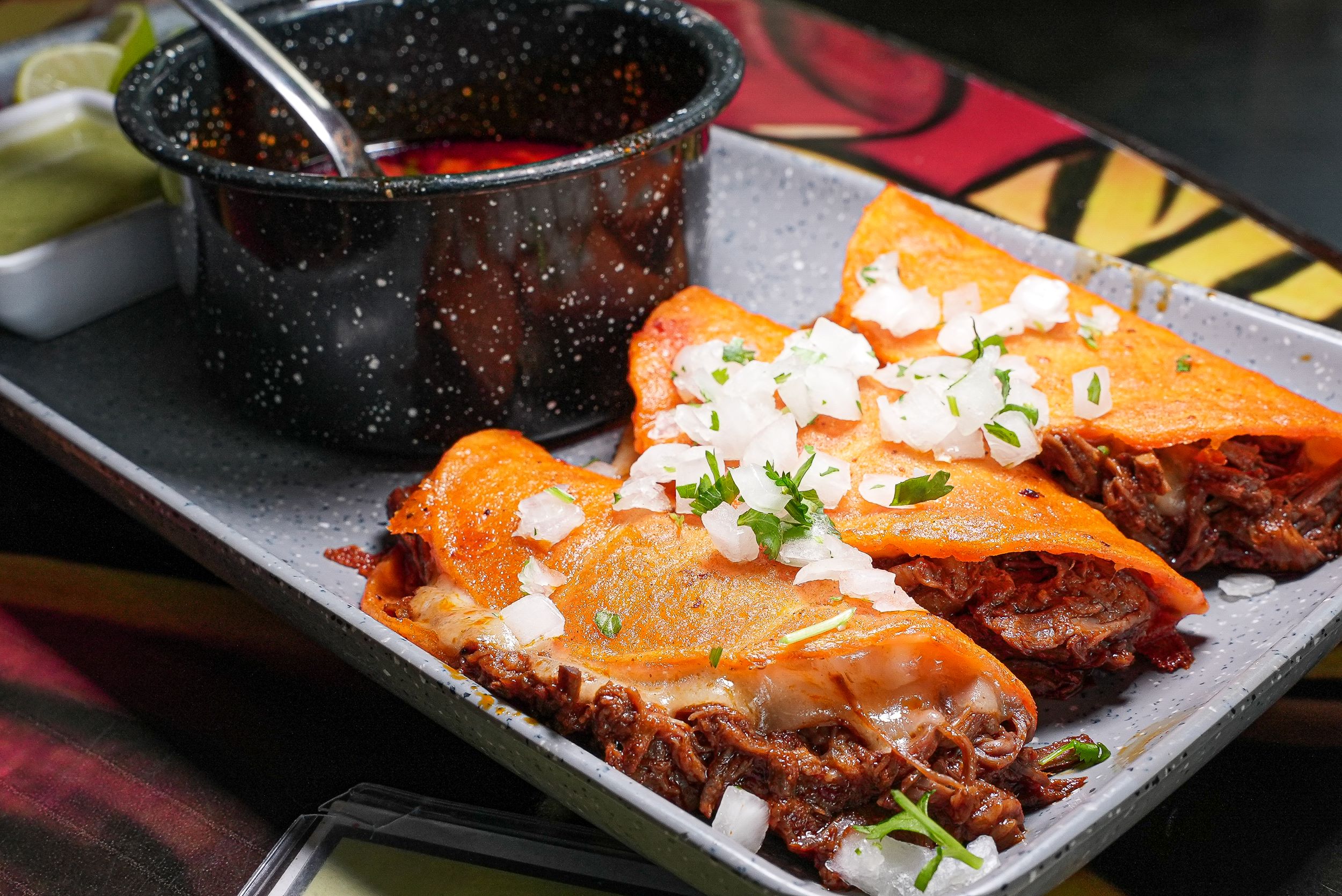 La Chingada Cocina Mexicana signature dishes Quesa-Birria - TacosMini ChimisQuesabirria PizzaBirria Nachos